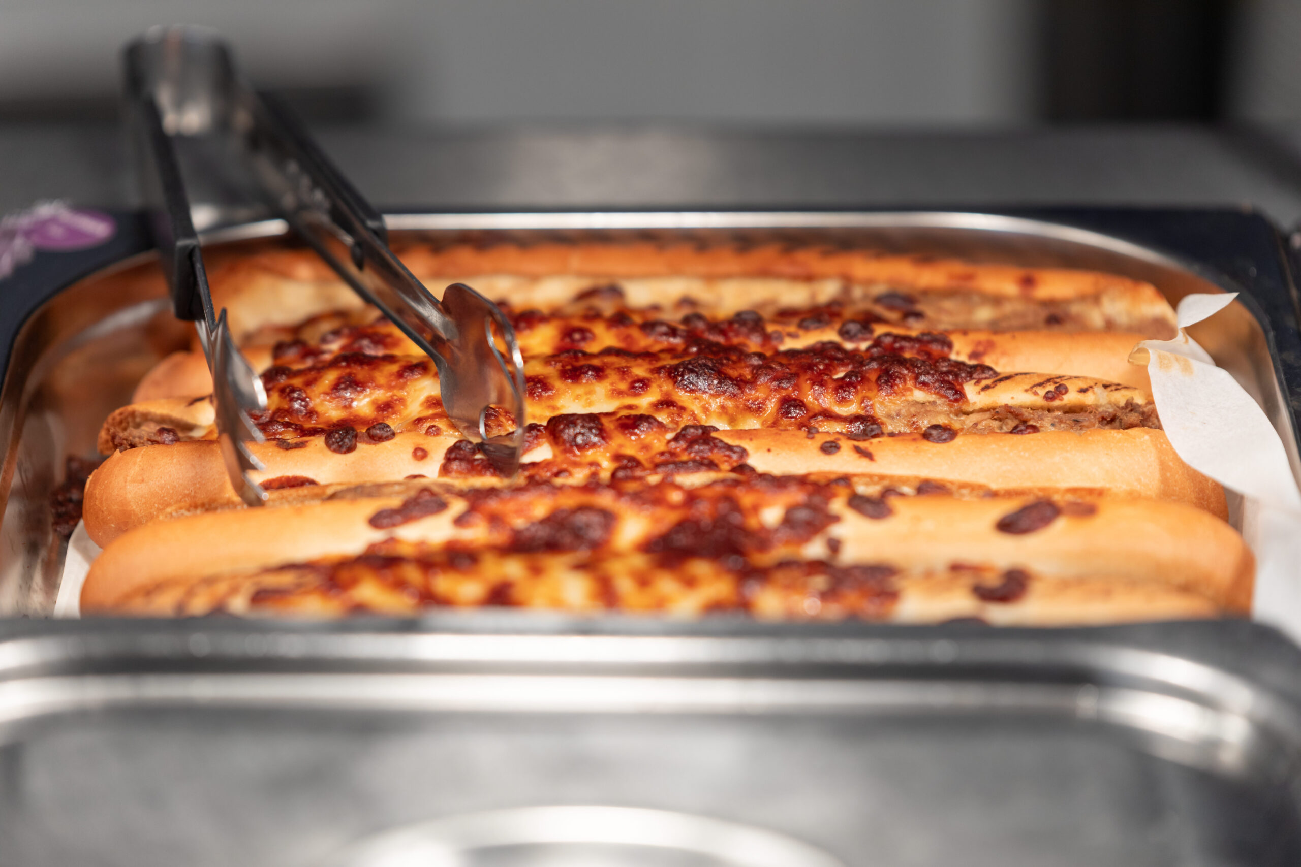 Close-up of hot food in a servery