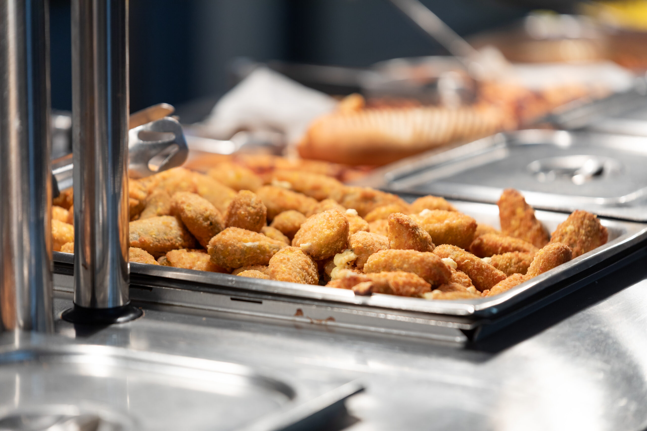 Close-up of hot food in a servery
